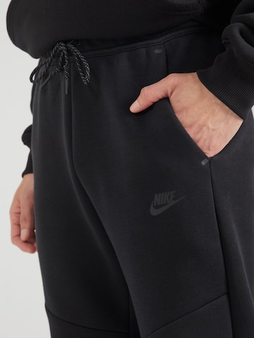 Nike Sportswear Zúžený strih Nohavice 'TCH FLC' - Čierna