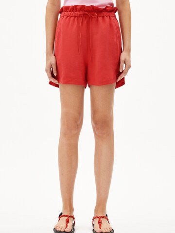 ARMEDANGELS Loose fit Trousers in Orange: front