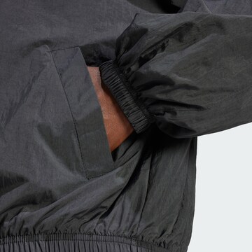 ADIDAS ORIGINALSPrijelazna jakna 'Essentials' - crna boja