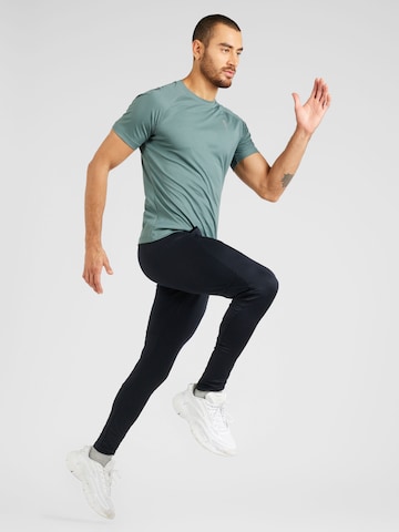 UNDER ARMOUR Zúžený strih Športové nohavice 'Challenger' - Čierna