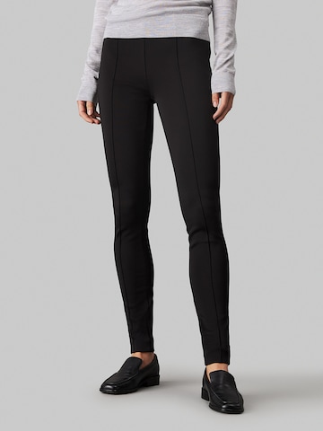 Calvin Klein Kitsas Retuusid, värv must: eest vaates