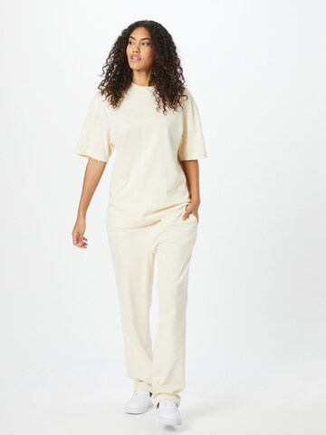 ABOUT YOU Limited Loose fit Trousers 'Rico' in Beige