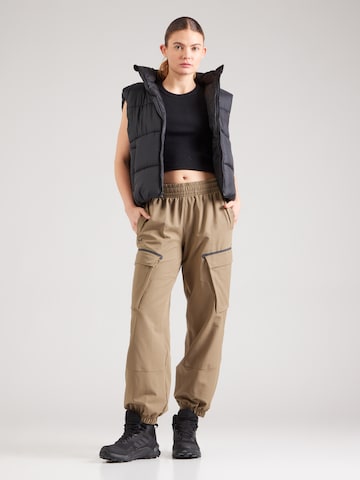 Tapered Pantaloni sport 'Unstoppable' de la UNDER ARMOUR pe maro