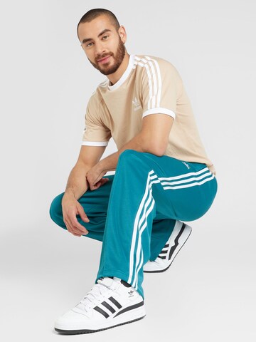 Baggy Pantaloni 'Adicolor Firebird' di ADIDAS ORIGINALS in verde